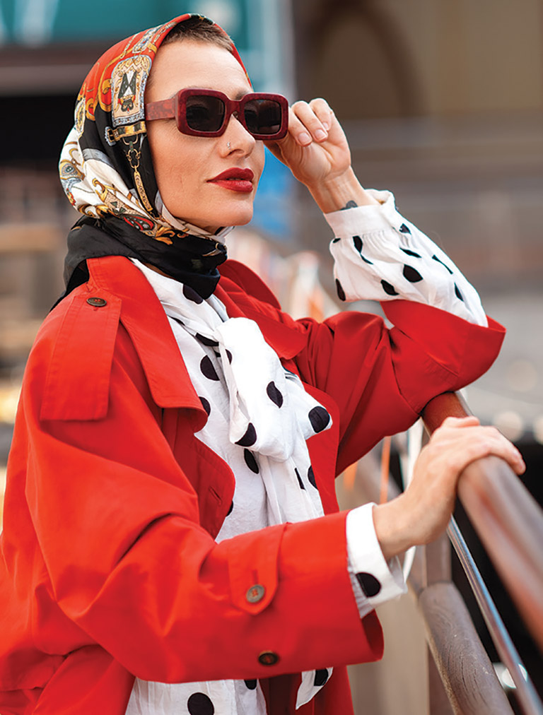 woman in red jacket and sunglasses